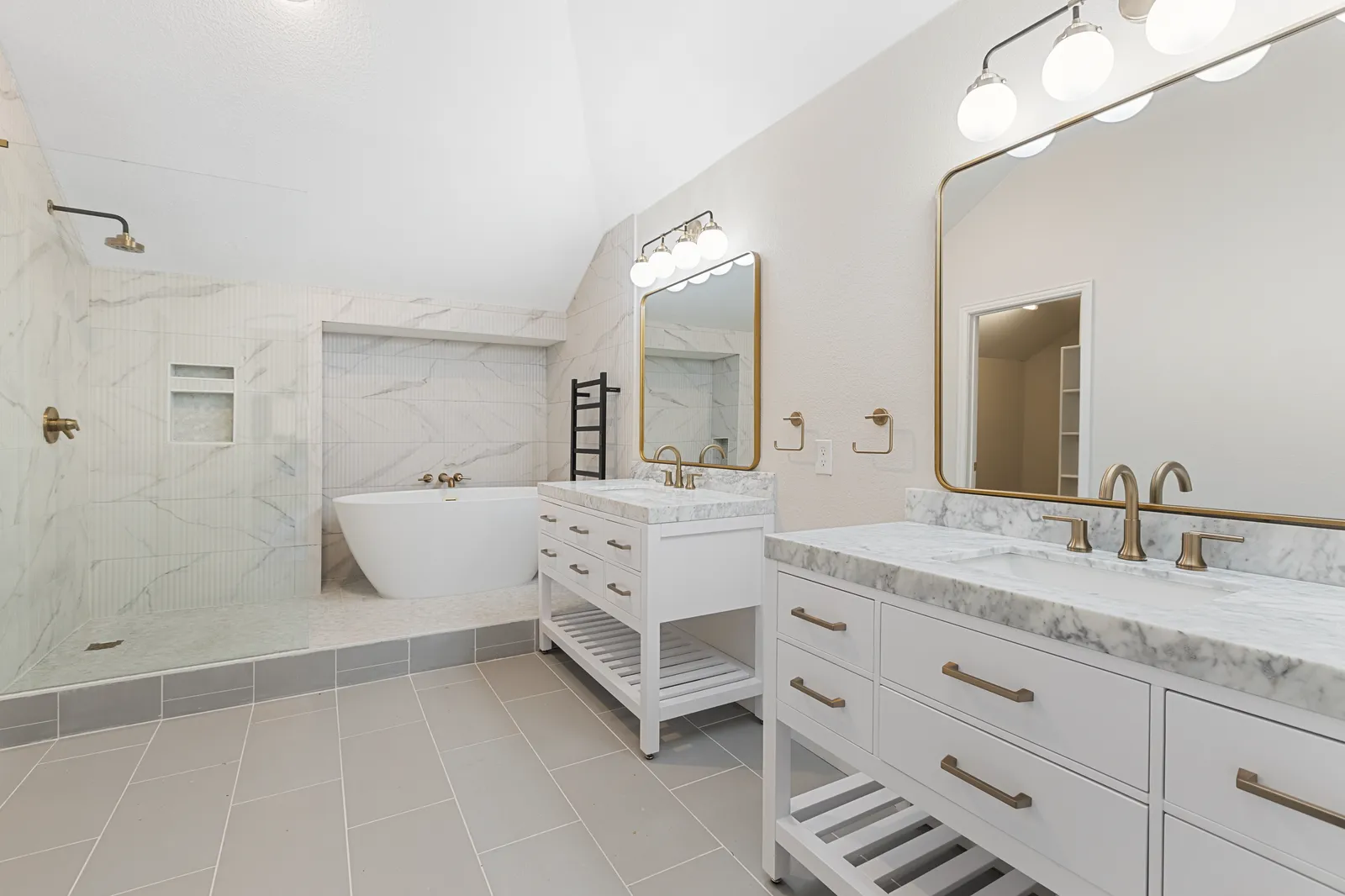 Bathroom refresh at Haven Pl in Allen: white double vanity, new mirrors, lighting, and tile