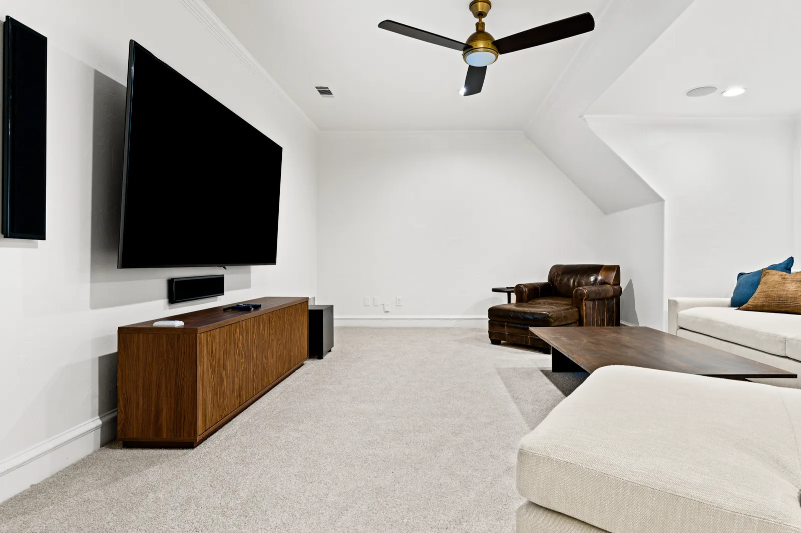 Media room at Prestwick Ln in Dallas after fresh paint, new carpet, and lighting
