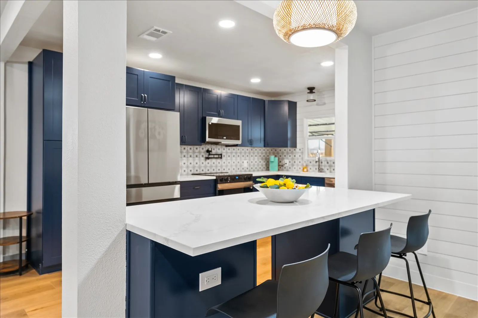 Sherman St. in Melissa kitchen after the renovation: navy cabinets and white shiplap
